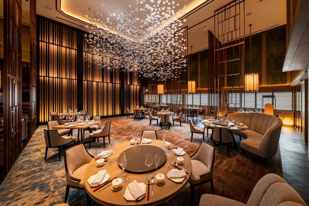 Extended dining setting with upholstered chairs and large round tables