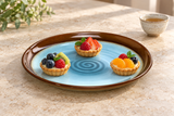 1-685-6 blue and brown round platter with three petite fruit tartlets