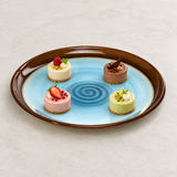 1-685-8 blue and brown round platter with four petite desserts