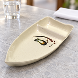 10-E speckled beige sushi boat dish with eggplant artwork on a light stone restaurant table