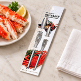 Two packaged 111074 crab picks beside a separate seafood plate