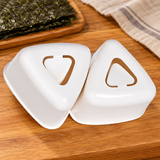 150780 white triangular sushi mold set on a wooden prep surface