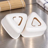 150780 white triangular sushi mold set on a stainless steel prep counter