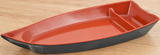 Black and red boat-shaped melamine serving plate with divider on a wood tabletop