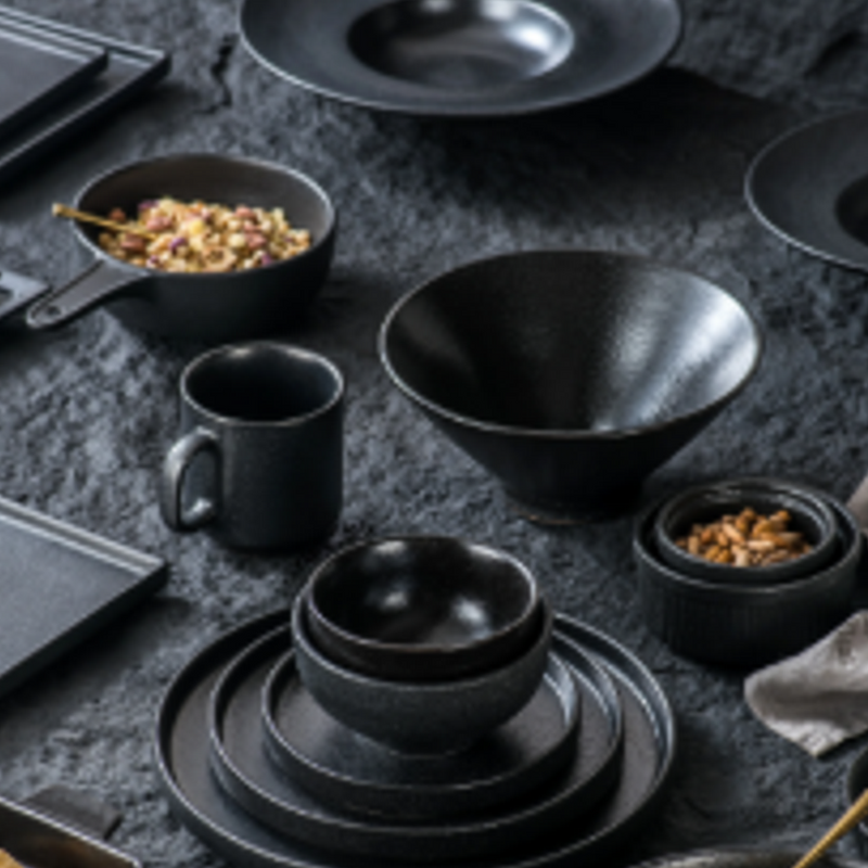 BK08 black tableware family with coordinated bowls, plates and mug; matching pieces available separately