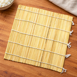 27-0006 bamboo sushi mat laid flat on a wooden prep surface