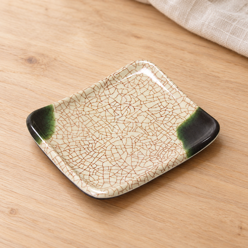 506-O Oribe plate in a wooden tabletop setting