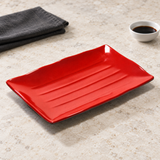511-BR empty red and black rectangular plate on a stone table