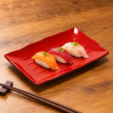 511-BR red and black rectangular plate with nigiri; serving suggestion