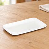 A003-213-02 white porcelain dish on a wood dining table