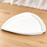 A003-65-04 white porcelain plate on a wood dining table