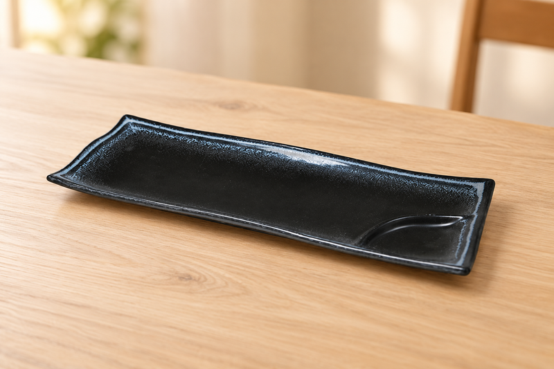 AS212-BK black ceramic plate with blue-gray rim in an empty wooden tabletop setting