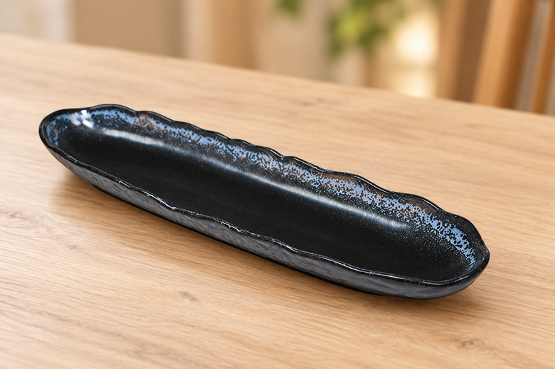 AS213-BK black ceramic plate with blue-gray rim in an empty wooden tabletop setting