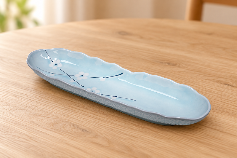 AS213-PL pale-blue plum-blossom plate in an empty wooden tabletop setting