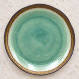 AS280-EM ceramic plate in a neutral tabletop setting