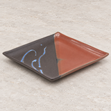BN29-B black and red square plate in a neutral tabletop setting