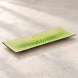D2145-E green patterned ceramic plate in a neutral tabletop setting