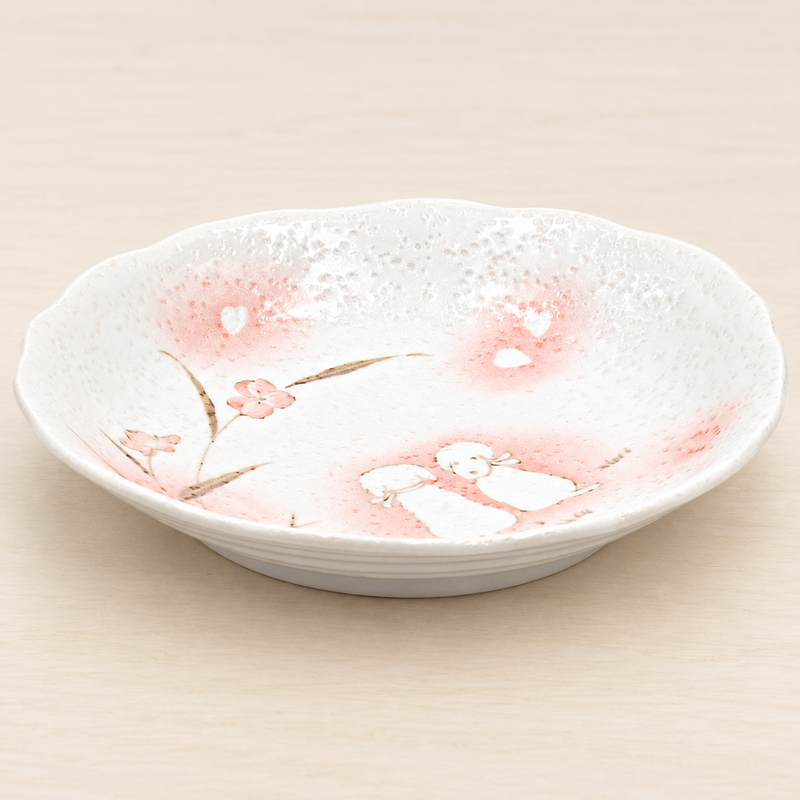 E510-D white and pink Puppies plate in a neutral tabletop setting