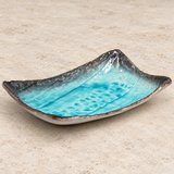 FDKN-9 turquoise glazed dish in a neutral tabletop setting