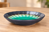 HS245-FG green glazed ceramic plate on a wooden dining table