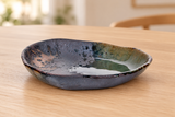 IM385-IK triangular ceramic plate on a light wood table