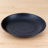 IT-Y7007B black dish in a neutral tabletop setting