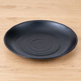 IT-Y7008B black dish in a neutral tabletop setting