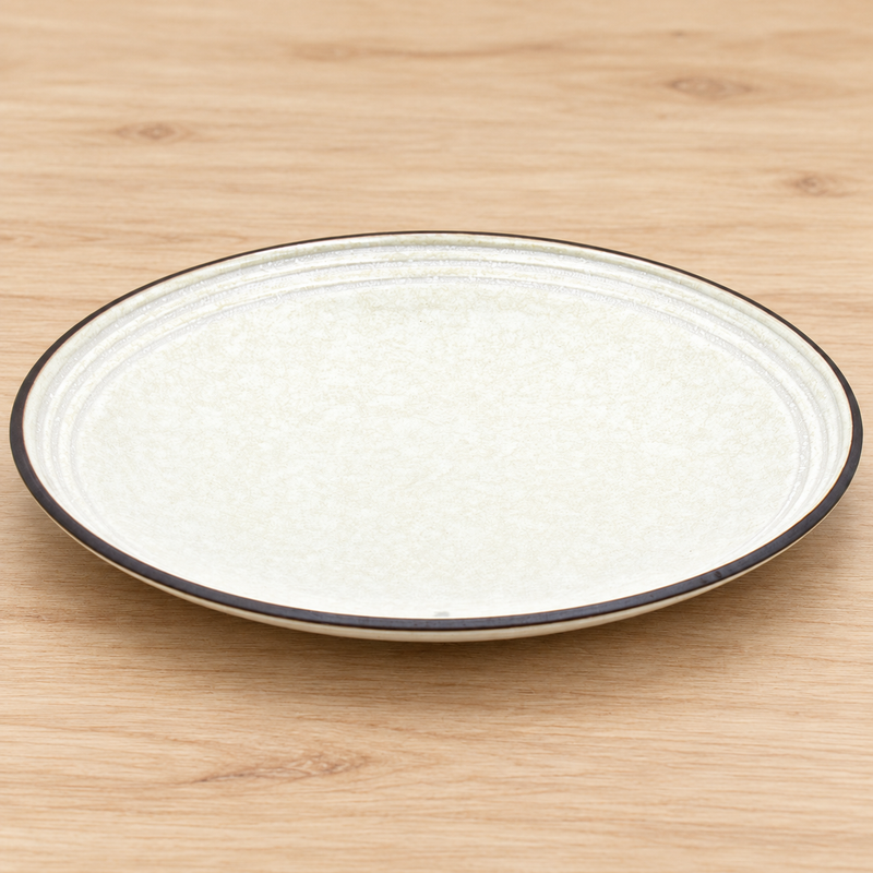 K210-PE ivory grooved plate in a neutral tabletop setting