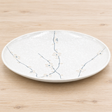 K210-WP white sakura ceramic plate on a light wood table