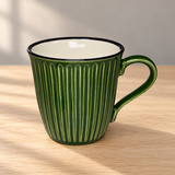 K72-GR green fluted mug on a wooden table
