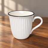 K72-WH white fluted mug on a wooden table