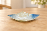 MS293-UN blue and beige square ceramic plate on a light wood table