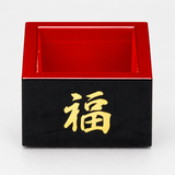 OMS-6 black and red sake masu cup in a frontal view with gold 福 character