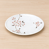 P275-CS ivory sakura blossom plate on a light wood table