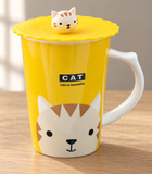 PC12-4 yellow cat mug with lid on a wooden table
