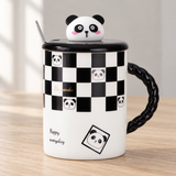 PC42-2 checkerboard panda mug with lid on a wooden tabletop