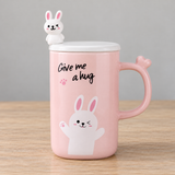 PC43-1 pink rabbit mug with lid on a wooden tabletop