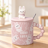 PC47-2 mauve rabbit mug with lid on a café table