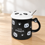 PC53-1N panda mug with lid and spoon on a pale wood tabletop