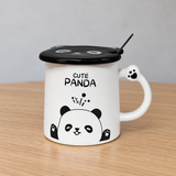 PC53-2 white panda mug with black lid on a wooden café table