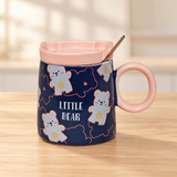 PC54-3 bear-print mug with pink lid and spoon on a pale wood tabletop