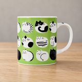 PH72-C4 green cat-pattern mug on a wooden table