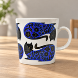 PH72-C6 blue and black cat-pattern mug on a wooden table