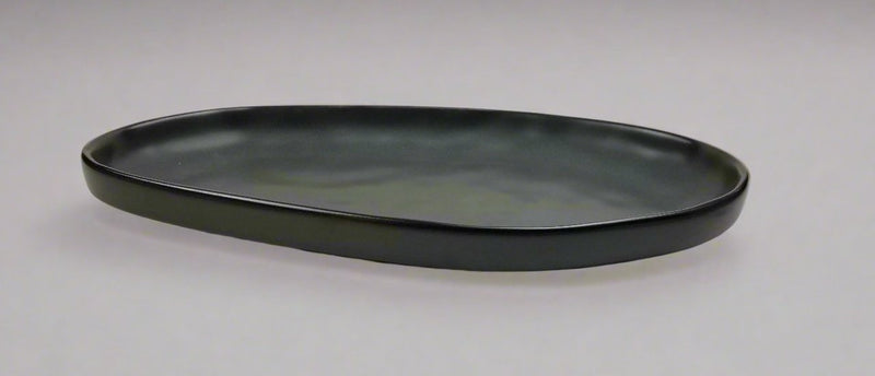 Side view of the RFR-13 dark-green oval porcelain plate