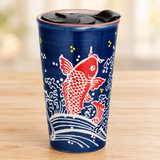 SM12-6728 red koi tumbler with lid on a pale wood tabletop