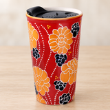 SM12-7176 red floral tumbler with lid on a pale wood tabletop