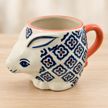 SMR-9 blue geometric flower rabbit mug on a pale wood tabletop