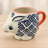 SMR-9 blue geometric flower rabbit mug on a pale wood tabletop