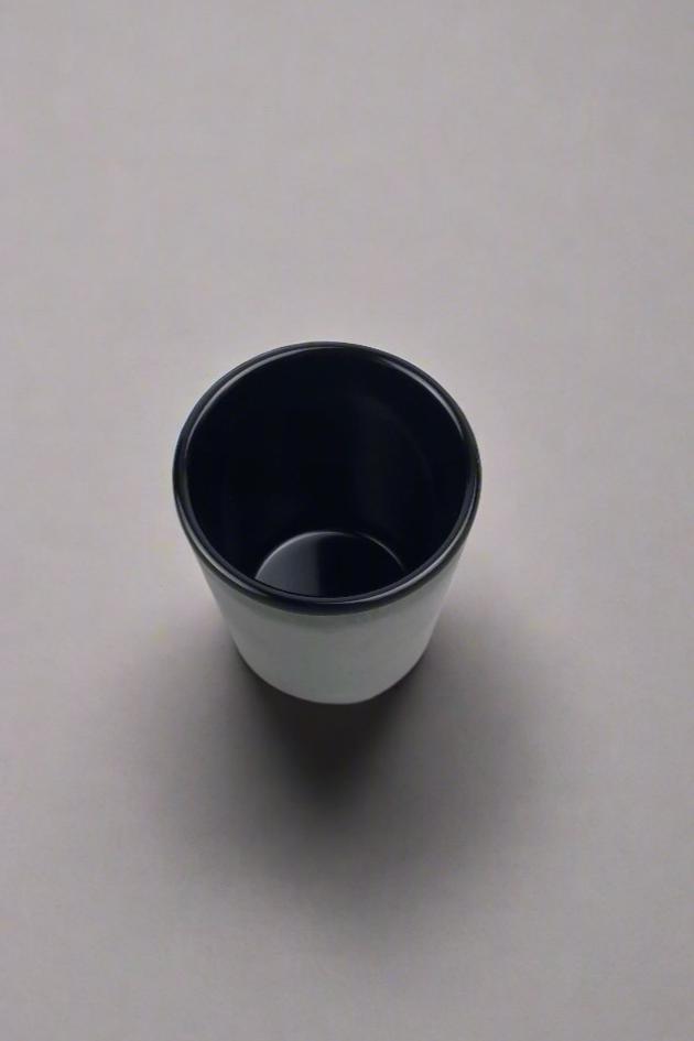 Overhead view of the round opening and dark interior of the YG-002MB cup