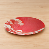 YG212-RWV red wave-pattern ceramic plate in a neutral tabletop setting
